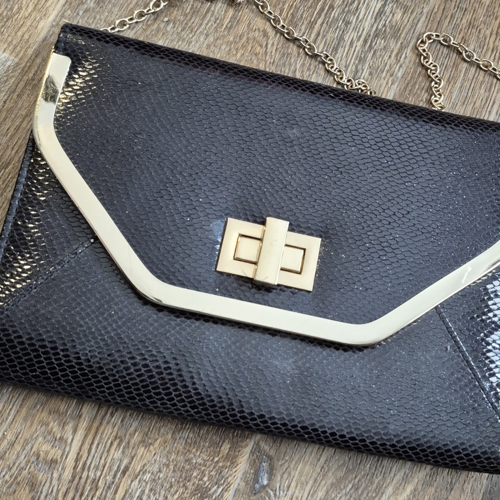 Elegant Aldo Black and Gold Chain Clutch